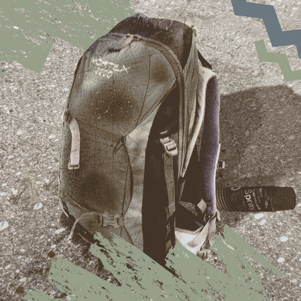 Badlands backpack with skull logo on rocky ground; side pocket holds a spray can. Earth-tone graphic accents.