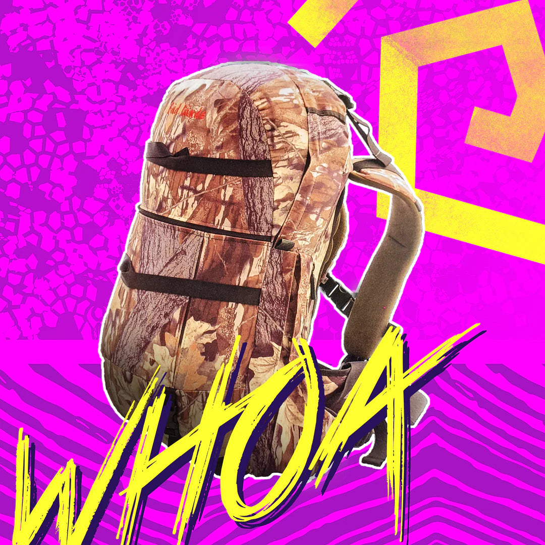Badlands camo backpack with logo, bold "WHOA" text, on a vibrant pink and yellow graphic background.