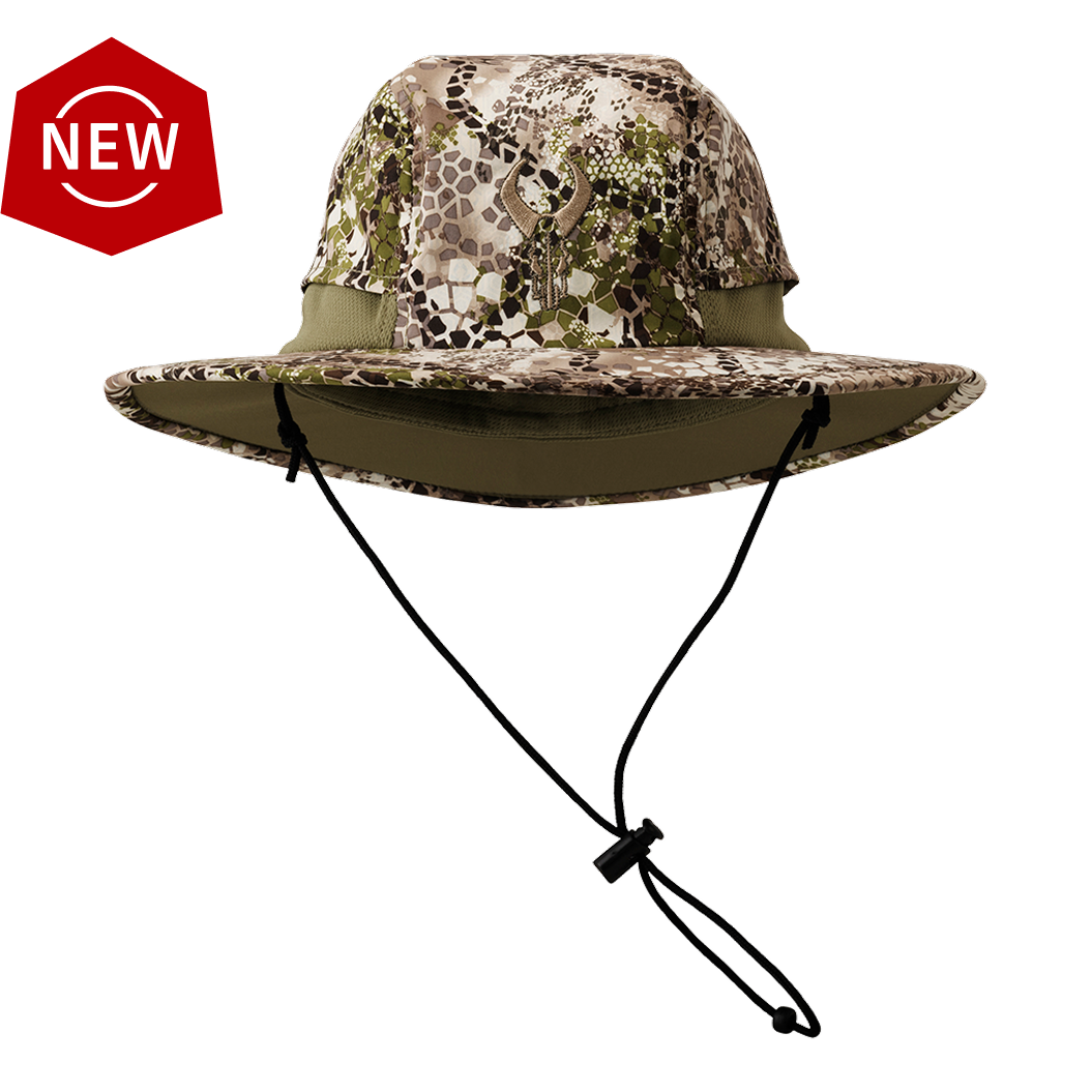 Camo boonie hat with Badlands skull logo, adjustable chin strap, and "NEW" badge in top left corner.