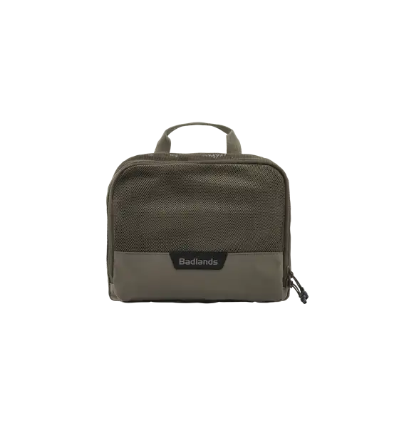 Tan Badlands gear bag with top handle and front Badlands logo, accessible zippered compartment, and durable fabric.
