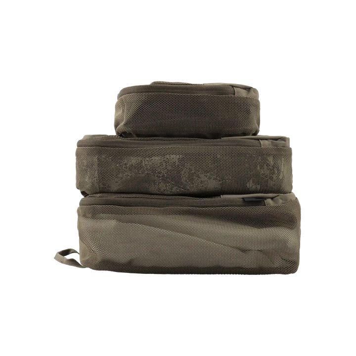 Three stacked Badlands packing cubes in tan mesh, featuring the Badlands skull logo on each cube.