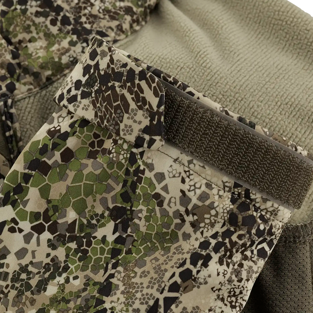 Close-up of Badlands camo jacket cuff with adjustable Velcro strap, showing detailed pattern and textured fabric.