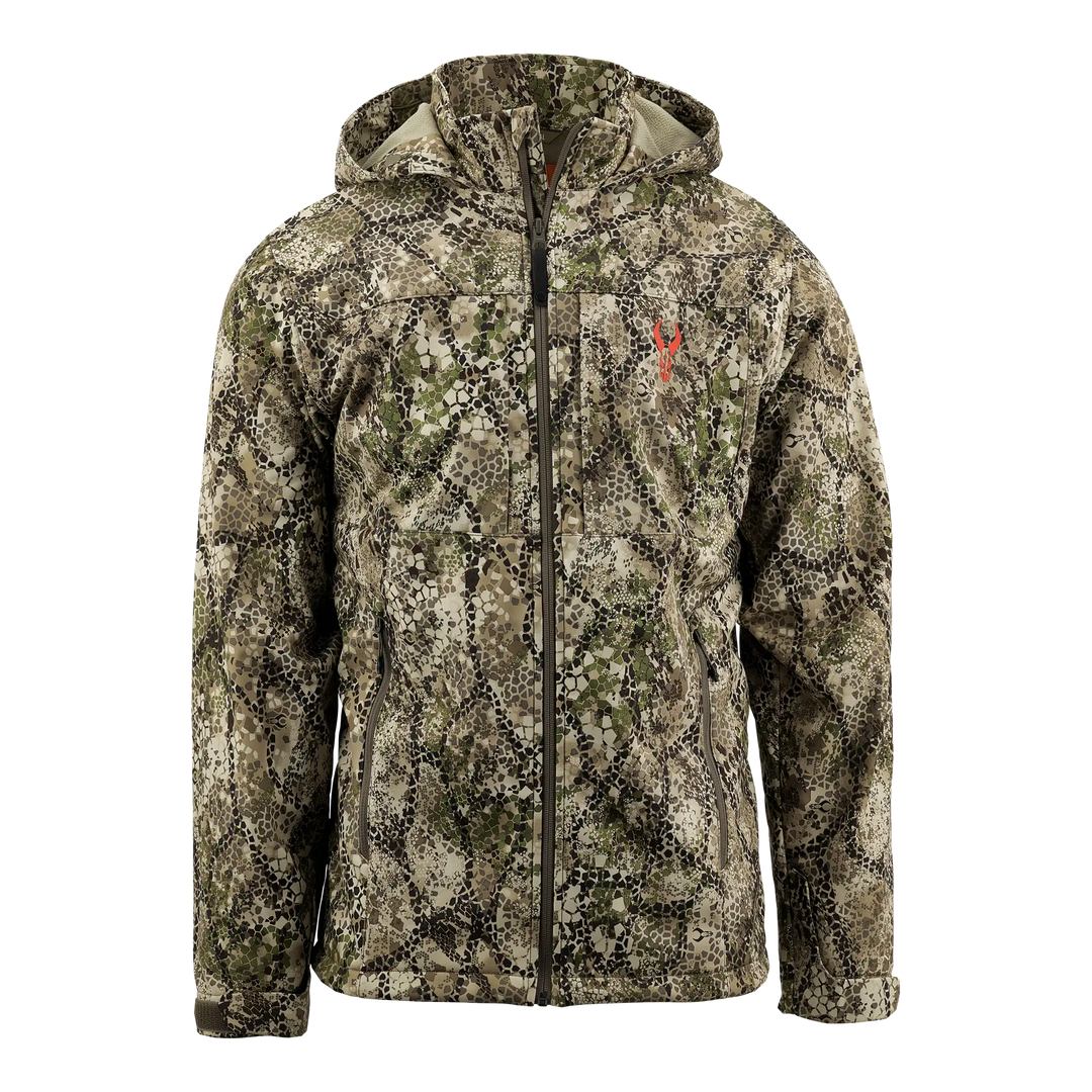 Camo jacket with hood, front zipper, and red Badlands skull logo on chest. Designed for outdoor or hunting use.