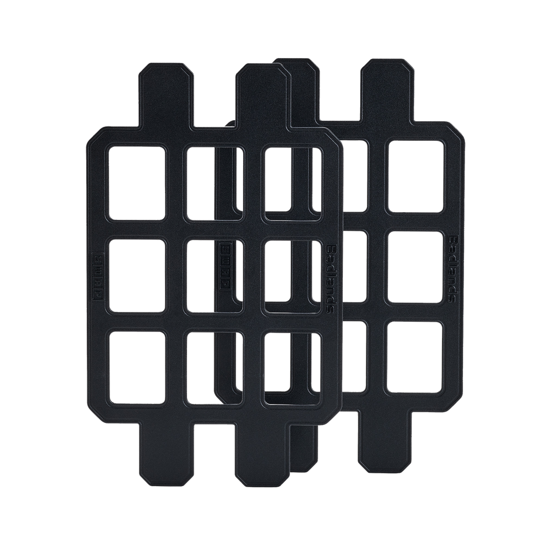 Two black Badlands GRID organizer panels with logo, designed for modular gear attachment and easy customization.
