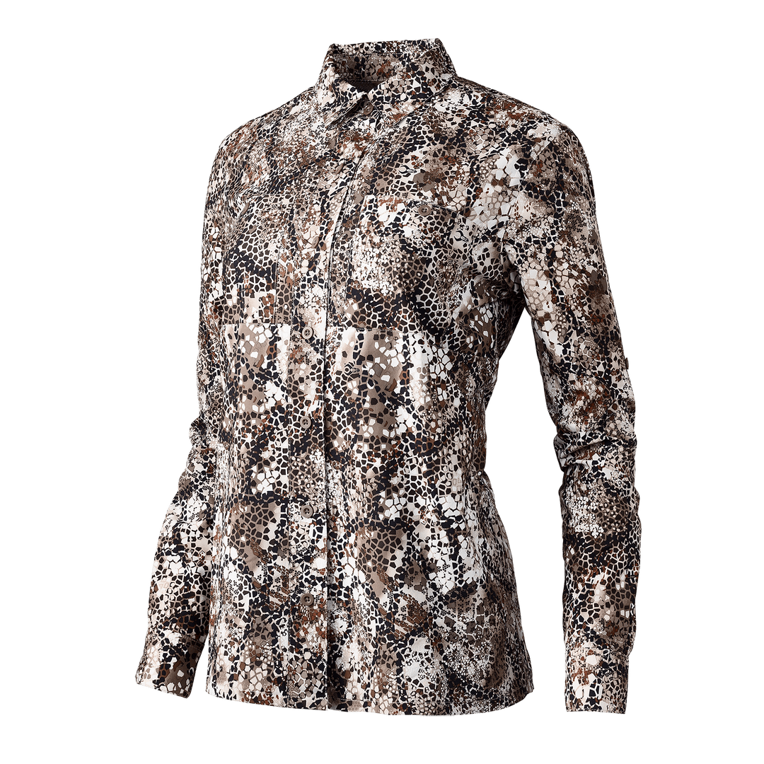 Women's Badlands camo hunting shirt with long sleeves and button front, featuring the Badlands skull logo.