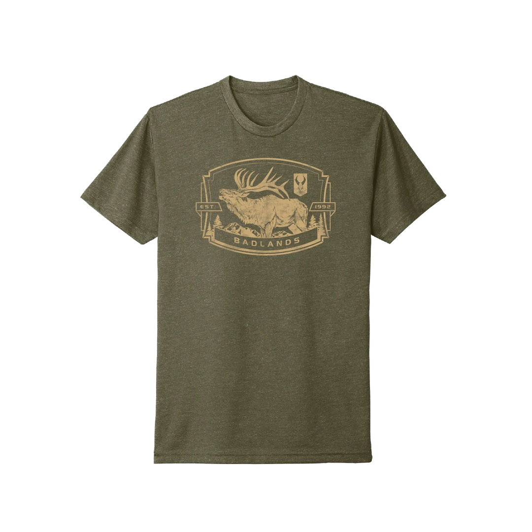 Olive Badlands t-shirt with elk, mountains, and Badlands skull logo graphic; text reads "EST. 1992 BADLANDS."