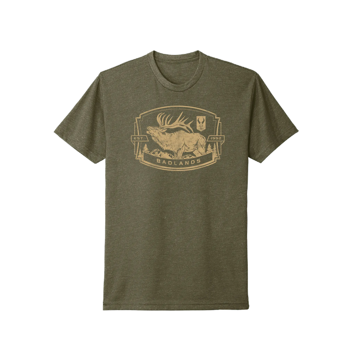 Olive Badlands t-shirt with elk, mountains, and Badlands skull logo graphic; text reads "EST. 1992 BADLANDS."