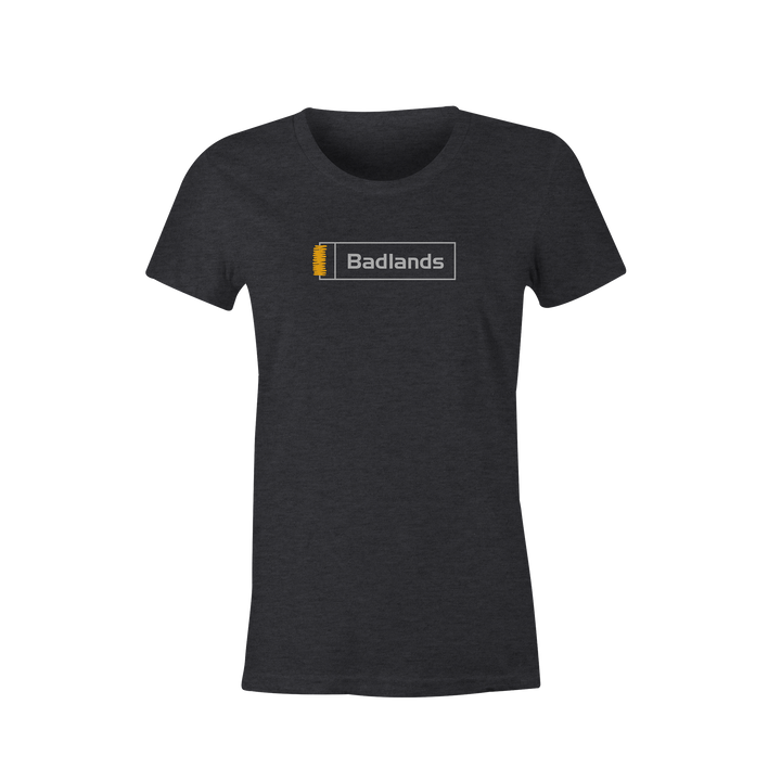 Charcoal t-shirt with Badlands logo and yellow skull graphic centered on chest. Simple, high-contrast design.