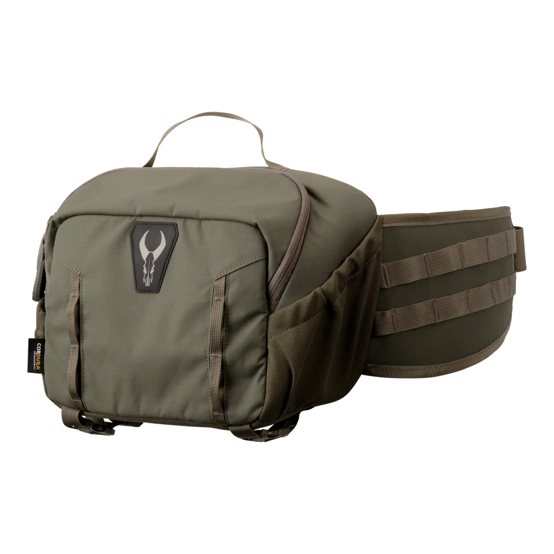 Olive green Badlands waist pack with large zippered pouch, side pockets, and skull logo on front. Adjustable padded belt.