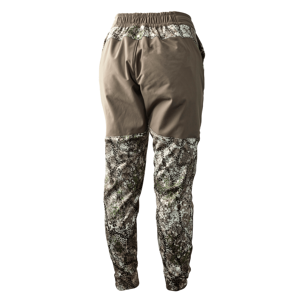 Badlands women's camo hunting pants with stretch waistband and Badlands skull logo on front.