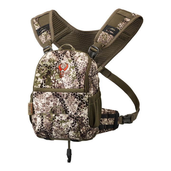 Badlands camo hunting pack with red skull logo, adjustable straps, and mesh back panel for comfort.