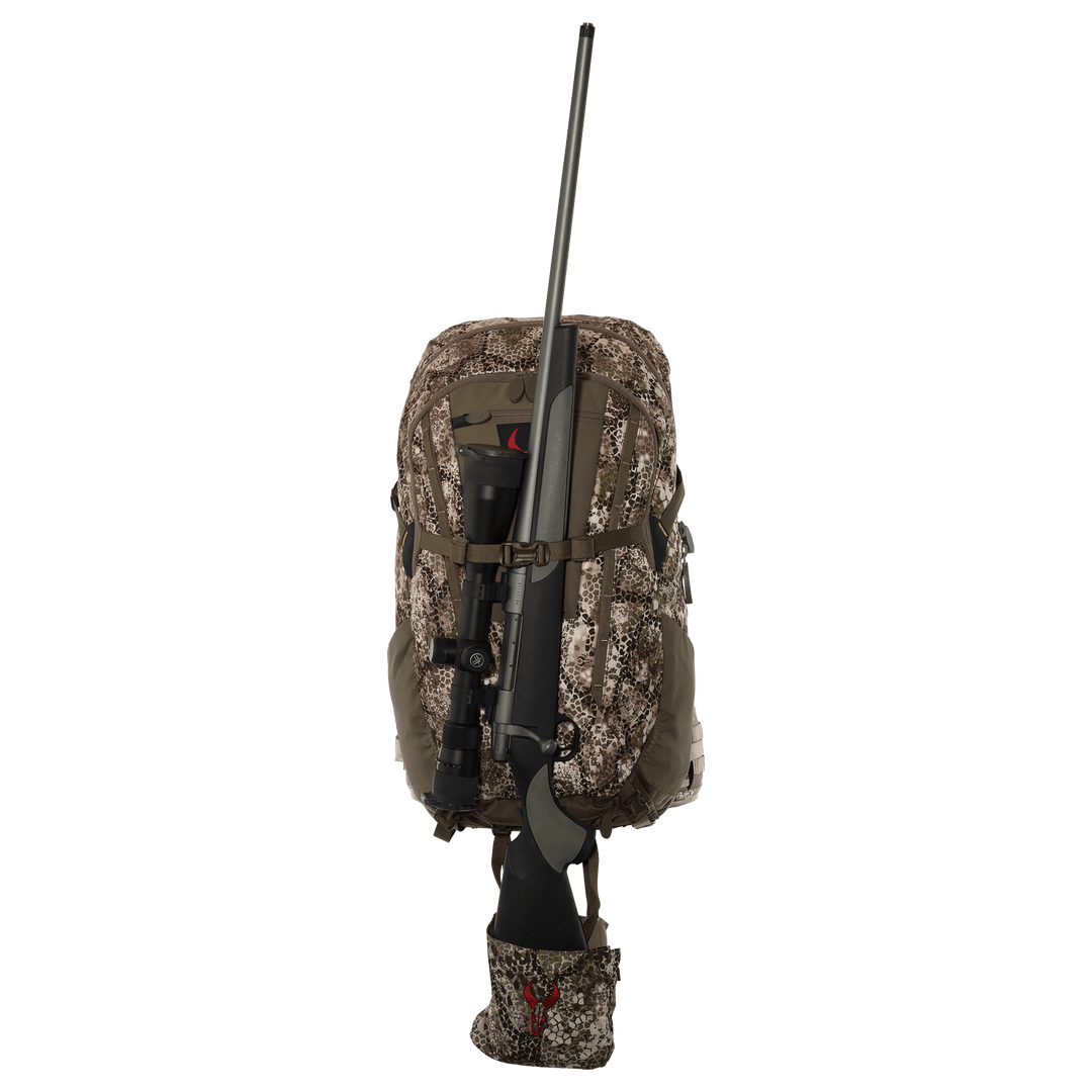 Badlands camo hunting backpack with rifle holder and red skull logo, designed for outdoor and ADA-friendly gear access.