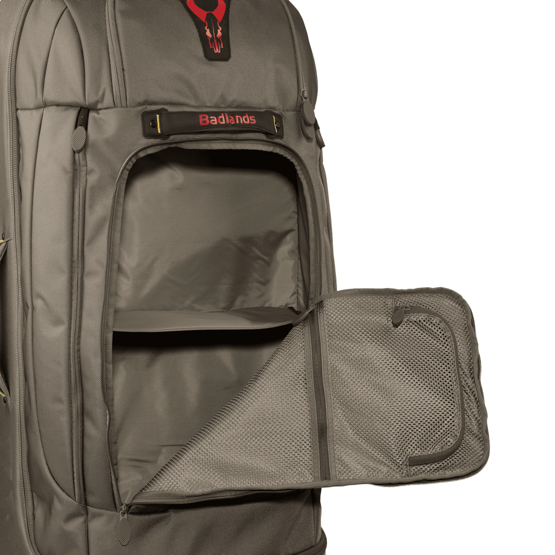 Badlands backpack with open front pocket, mesh organizer, and visible red skull logo above the brand name.
