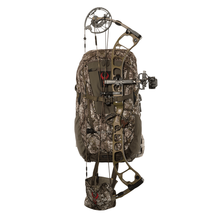 Badlands camo hunting backpack with bow attached; red skull logo visible on pack and bow holder.