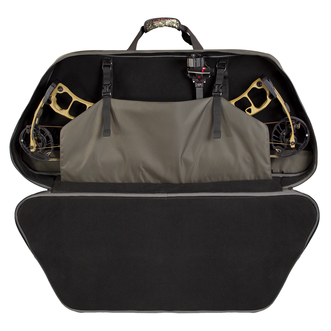 Badlands bow case open, showing interior straps securing a compound bow; Badlands skull logo on handle.