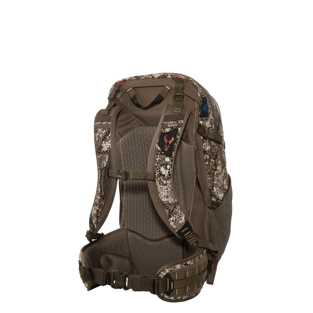 Badlands hunting backpack, camo pattern, padded straps, and Badlands skull logo on the back panel.