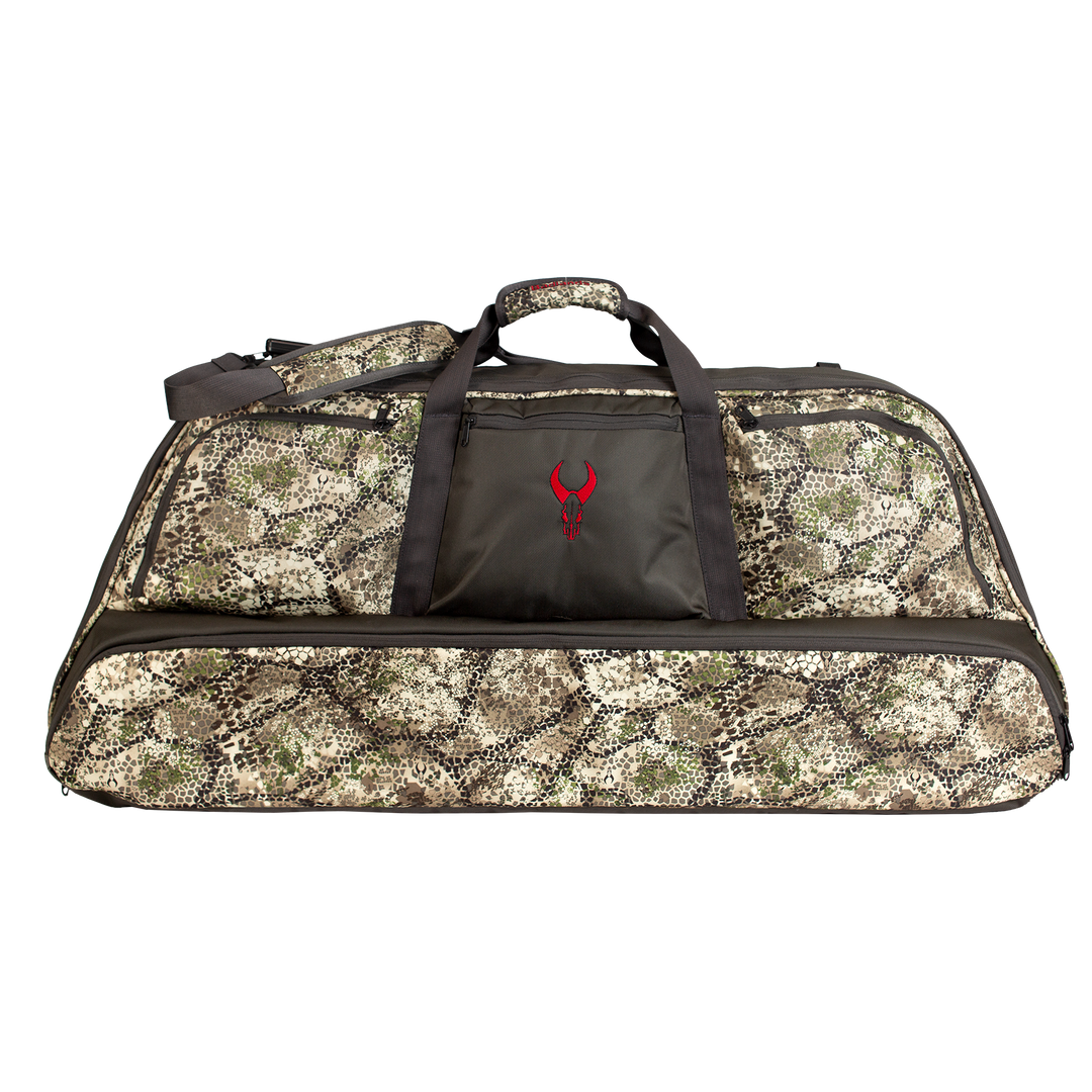 Camo duffel bag with black handles and a red Badlands skull logo on the front pocket.