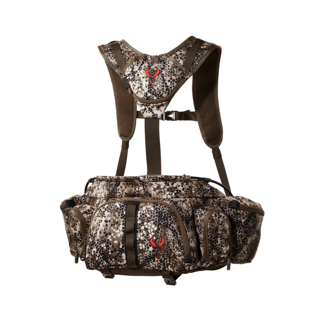 Badlands camo hunting pack with red skull logo, multiple pockets, and padded shoulder straps for comfort and support.