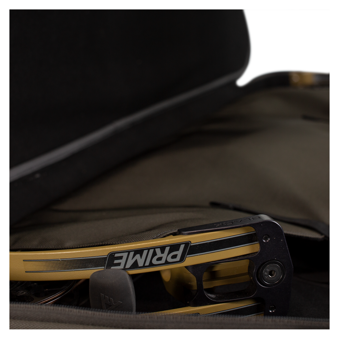 A Prime bow inside an open Badlands case; Badlands skull logo visible on the case for brand identification.