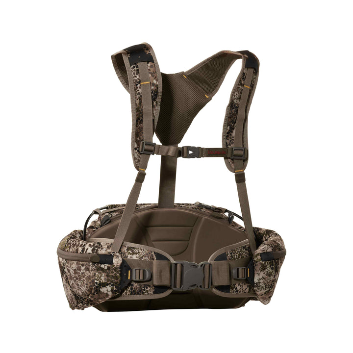 Badlands camo hunting pack harness with padded straps, waist belt, and skull logo; ergonomic and adjustable design.